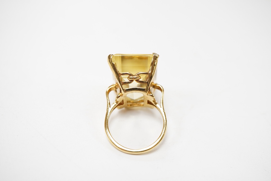A citrine ring, circa 1973, claw-set with a step-cut citrine measuring approximately 19 x 15 x 11mm, mounted in 9ct gold, size M, British hallmarks, gross weight approximately 10 grams
